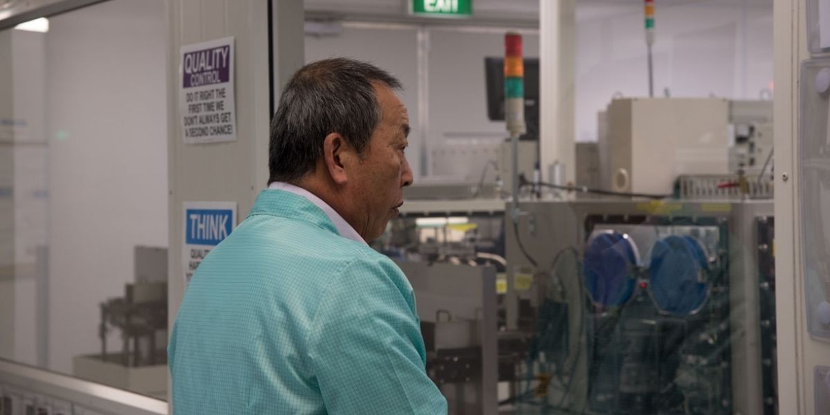 Lean Consultant Akinori Hyodo observing the Cleanroom